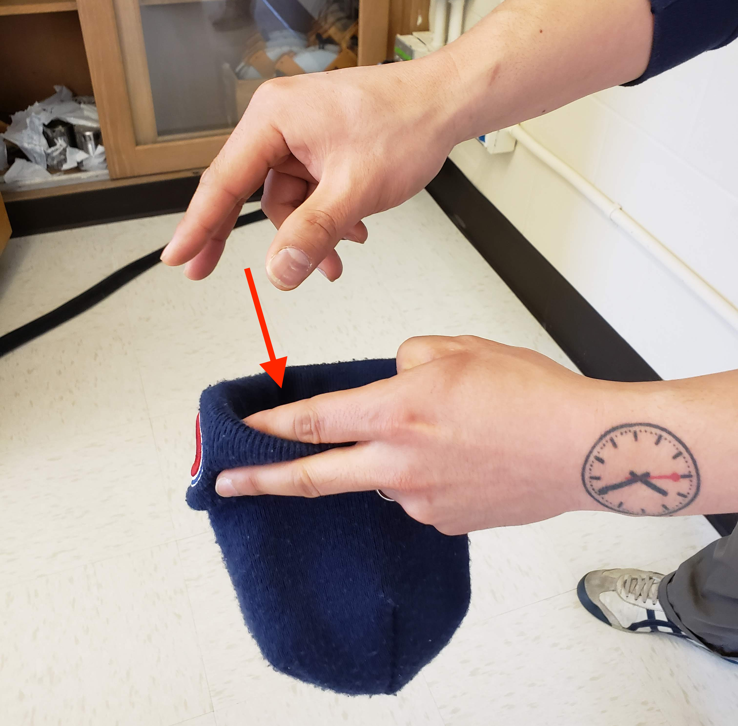 Photo illustrating the act of replacing an item back into a container after sampling.