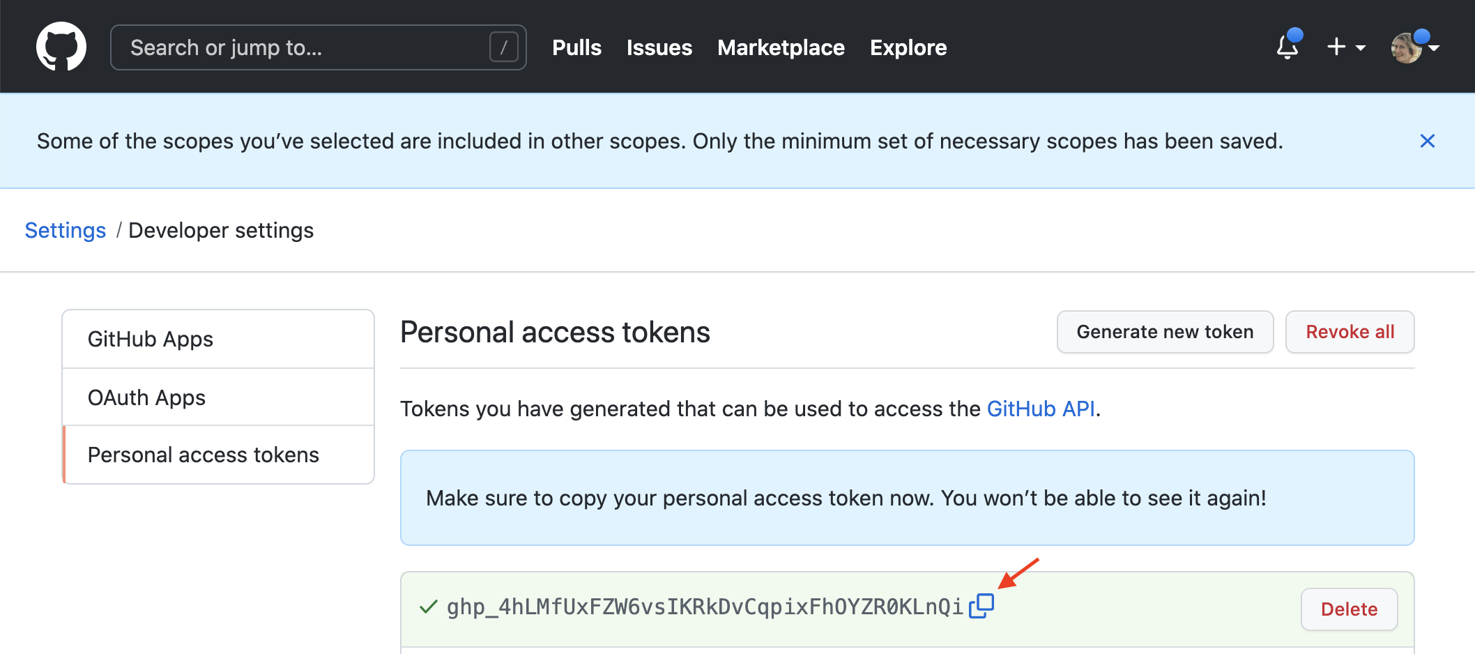 Screenshot of the GitHub personal access token page showing the newly generated token that must be copied and stored immediately.